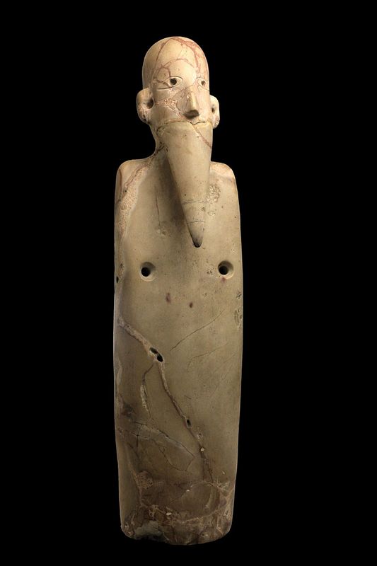 Figurine of a bearded man 38003500 BC breccia from Upper Egypt Musée des Confluences Lyon France