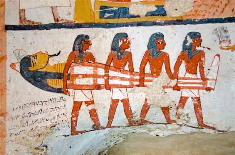 Four men carry a mummy. Decoration of the tomb of Ameneminet Tomb Robbing in Ancient Egypt tomb raiders