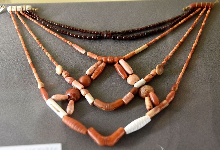 Necklaces with different types of beads. Carnelian coral and garnet. 1st Dynasty c. 3000 BCE. From the Tomb of Mena Naqada or Abydos Cemetery B Egypt. The Petrie Museum of Egyptian Archaeology London