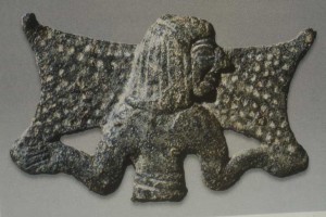 feature vassos main photo Fragment from a bronze four sided stand now in the Royal Ontario Museum shows represents a Cypriot carrying an ingot. 12th cent 300x200